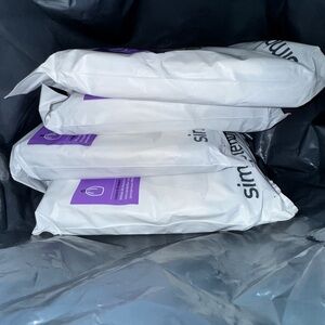 4 PACKS OF SIMPLE HUMAN BAGS ALL BRAND NEW . SIZE H .